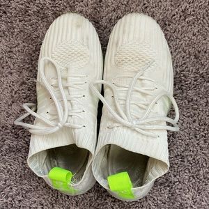 Size 6 white and lime green tennis shoes. Very worn out.
